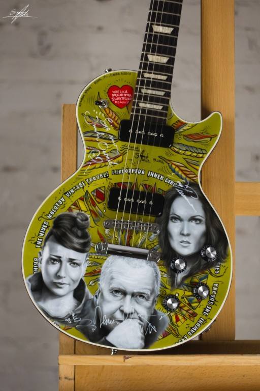 Gitara Gibson Les Paul&rsquo;50s pomalowana przez Szymona Chwalisza z wizerunkami i autografami artyst&oacute;w, kt&oacute;rzy wystąpili podczas 22. Przystanku Woodstock.<br /> <br /> Obecna cena: 3 050 zł <br />...