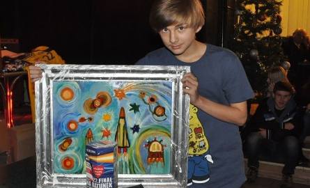 Kolorowy obraz Wiesława Zuchmańskiego z Warsztatów Terapii Zajęciowej zakupił za 360 nastolatek Bartosz Bocheński.